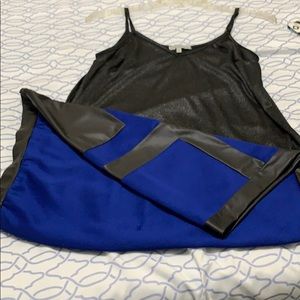 Shiny black tank top with mini skirt